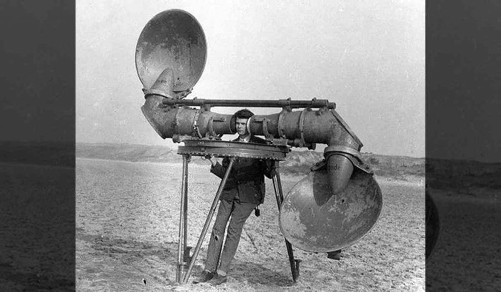 aircraft listeners - a person using an acoustic locator to detect distant aircraft