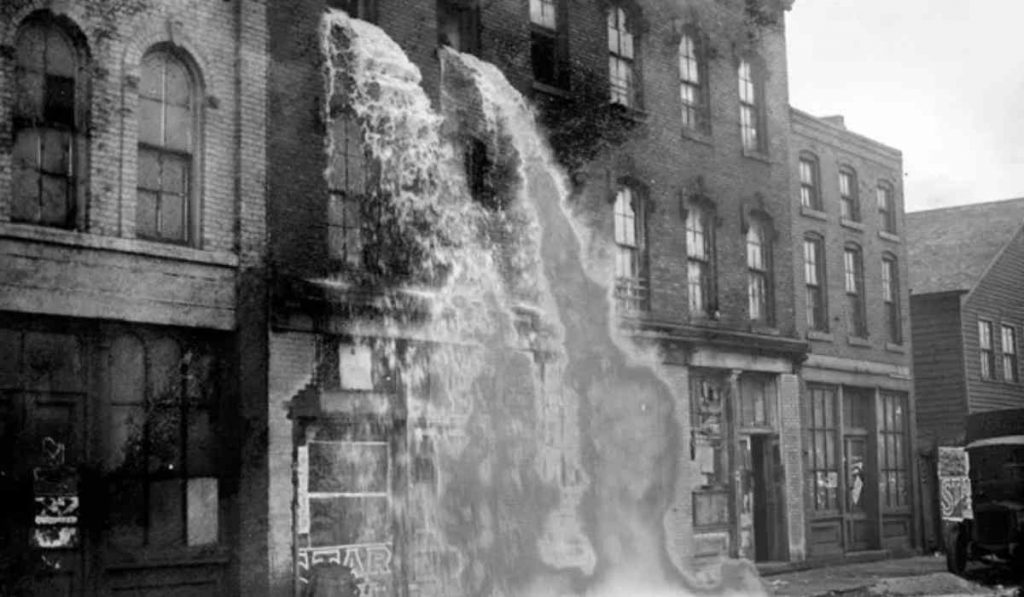authorities raiding and destroying alcohol from illegal distilleries during prohibition