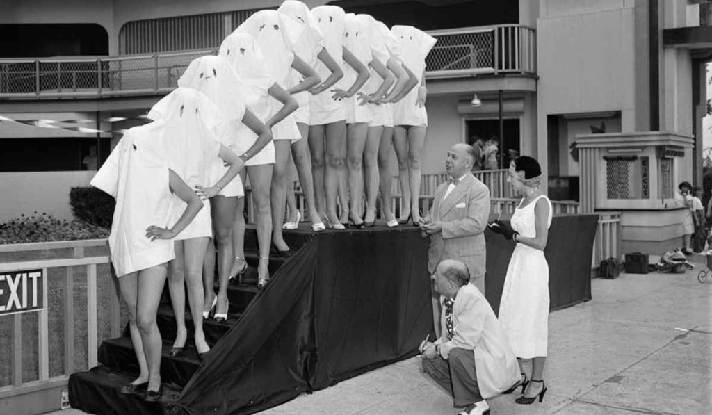 Beautiful Leg Contest featuring participants with pillowcases over their heads