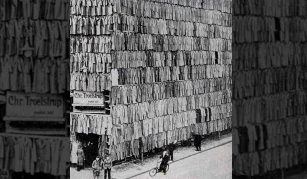 over thousand coats hanging from a scaffold in an effective way to sell clothes